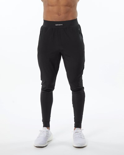 Alphalete Woven 4-Way Stretch 29" Pant Blackout | 973-AGOHWE